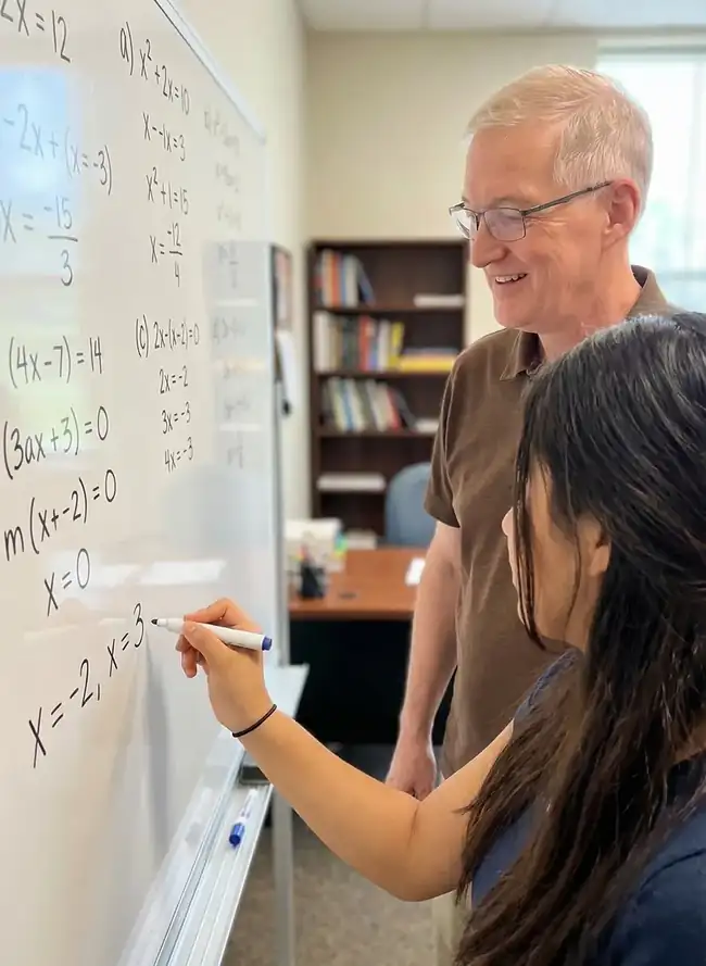 Student preparing for the SAT with study materials